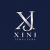 Xini Jewellers silver XJ logo on theme navy